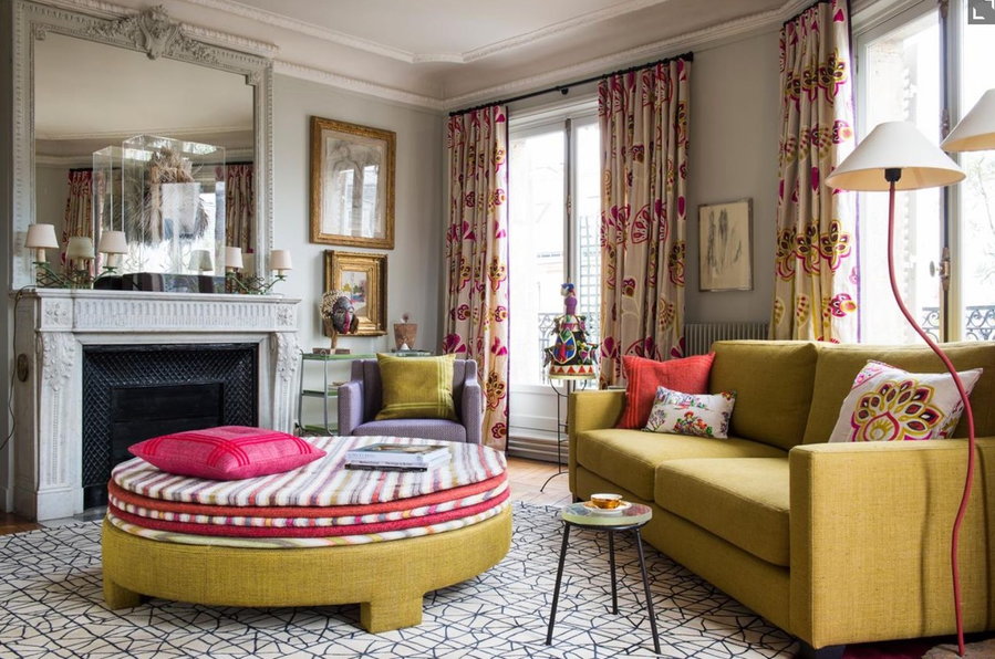 Simple yet refined living space complete with a large central ottoman in the Pierre Frey owners' hip Paris apartment.