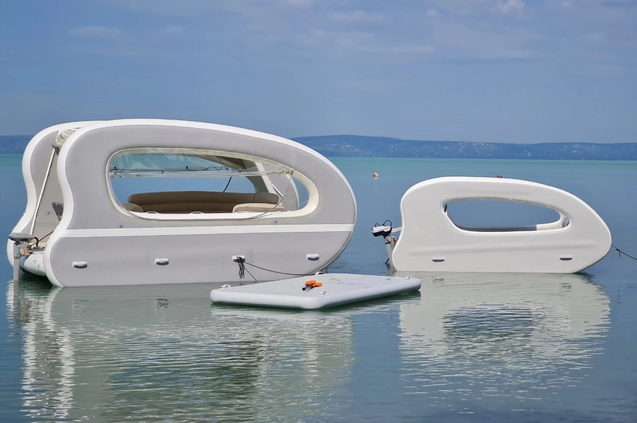 Deluxe Portless Catamaran (left) next to a standard size model (right).
