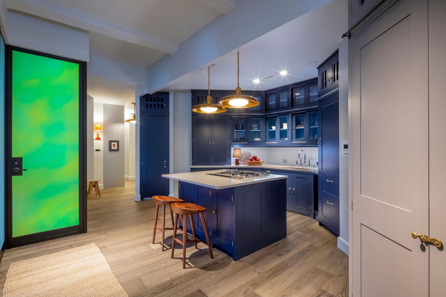 Angular gray and blue kitchen area in director David Gordon Green's Kubrick-inspired New York City loft.