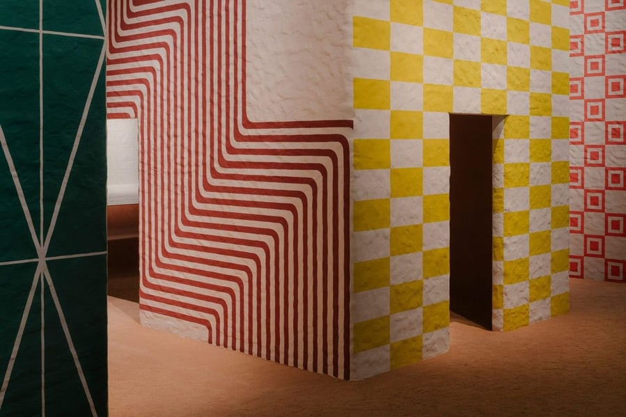 Brightly patterned buildings made up Hermès' tiny village display at Milan Design Week 2021.