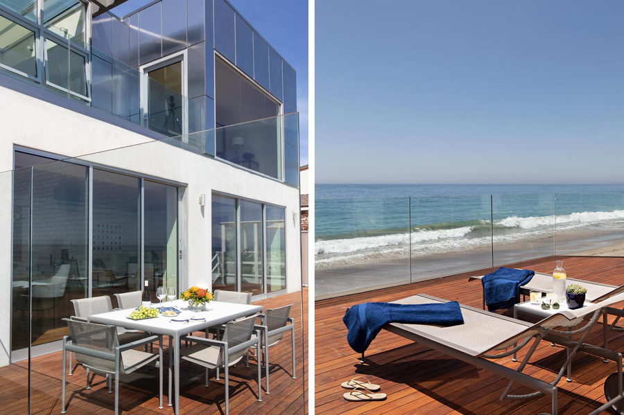 The minimalist wooden deck at the rear of the metallic Malibu Beach Home, complete with stunning views of Pacific.