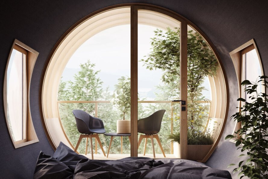 Interior lounge area sits right next to one of the Bert treehouse's large circular windows for a breathtaking view of the surrounding forest.