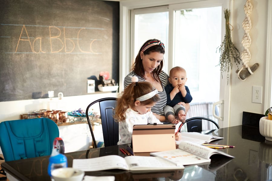 A young mother helps her kids learn remotely in a beautifully renovated home classroom.