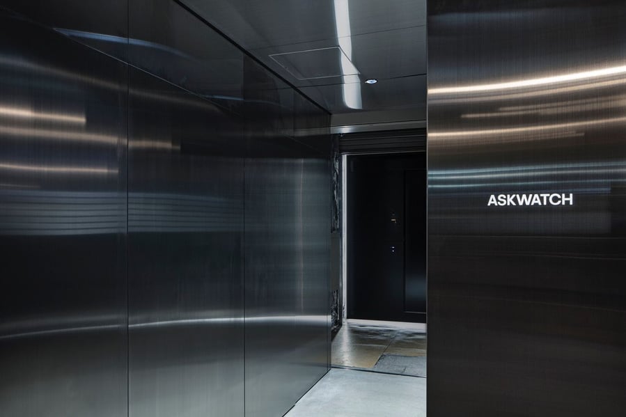 Sleek steel entrance to Tokyo's new ASKWATCH store is intentionally different from the largely concrete interiors. 