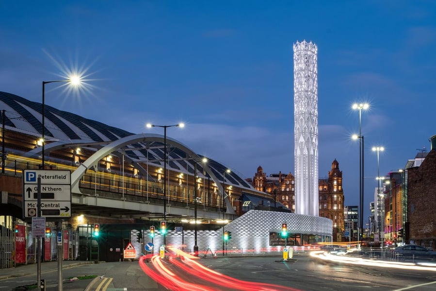 Nighttime view of the Tonkin Liu-designed Tower of Light in Manchester, England.