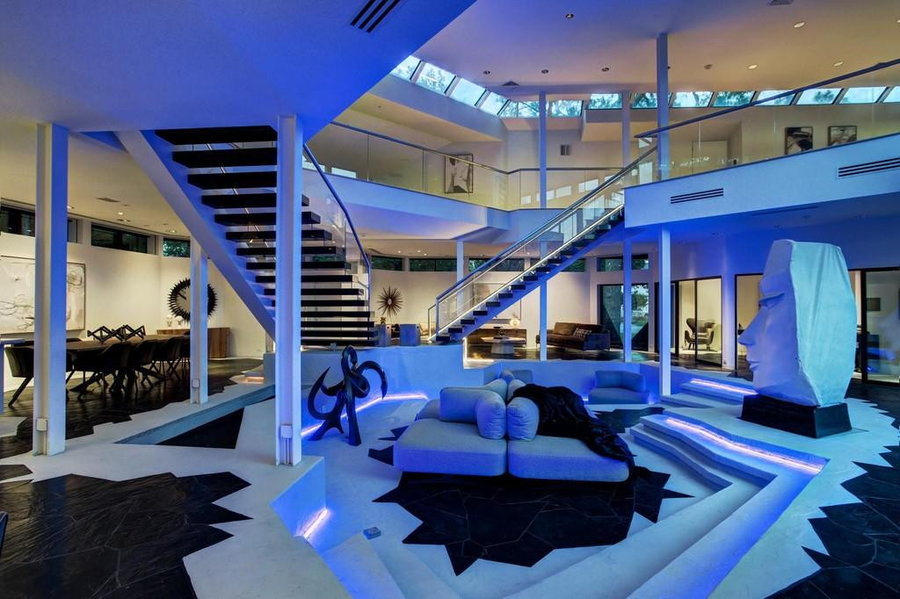 Soft blue light illuminates the living area and conversation pit inside Houston's mysterious Darth Vader House.