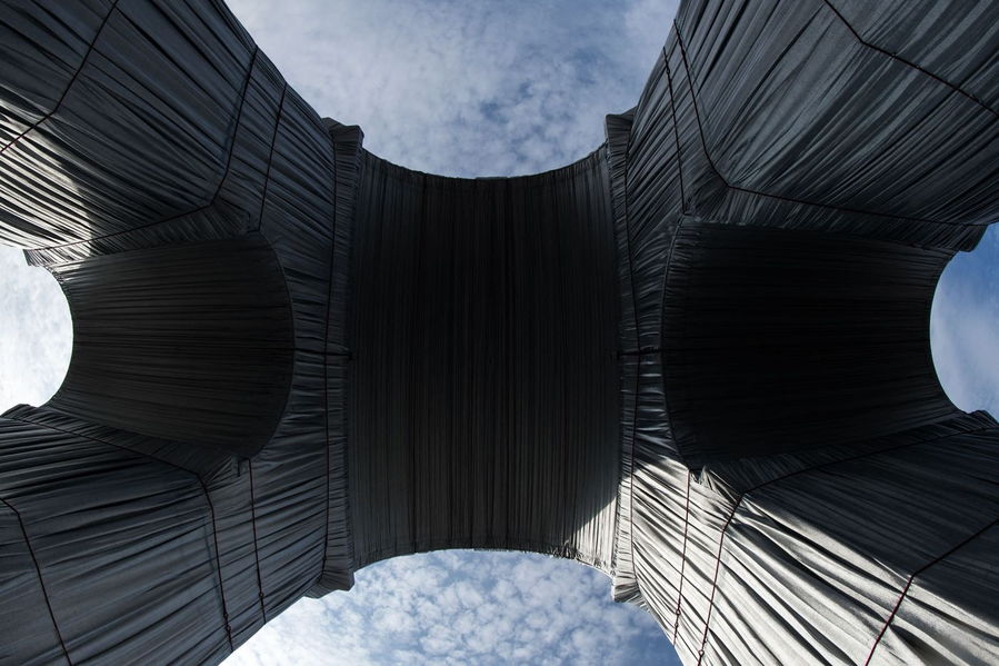 View of Christo's wrapped-up Arc de Triomphe from below.