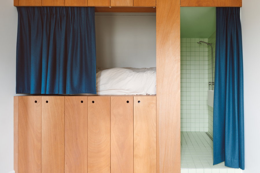 Lofted bed and built-in cabinets make the small kids' bedroom in the Gambetta apartment building feel much larger than it really is.