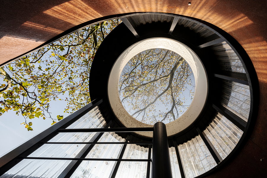 At the top of the spiral staircase rests a lovely big oculus, under which sit the lookout tower and outdoor shower. 