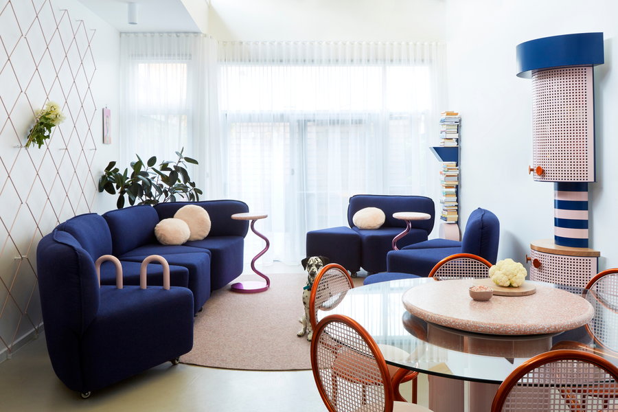 The living area inside Frenches Interiors is cozy, colorful, and centered around a neat modular 