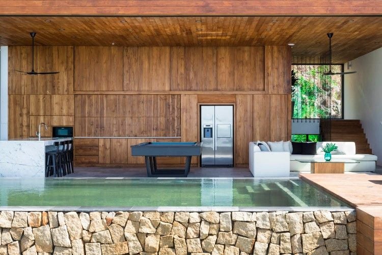 vietnam luxury house with stone pool and wood walls