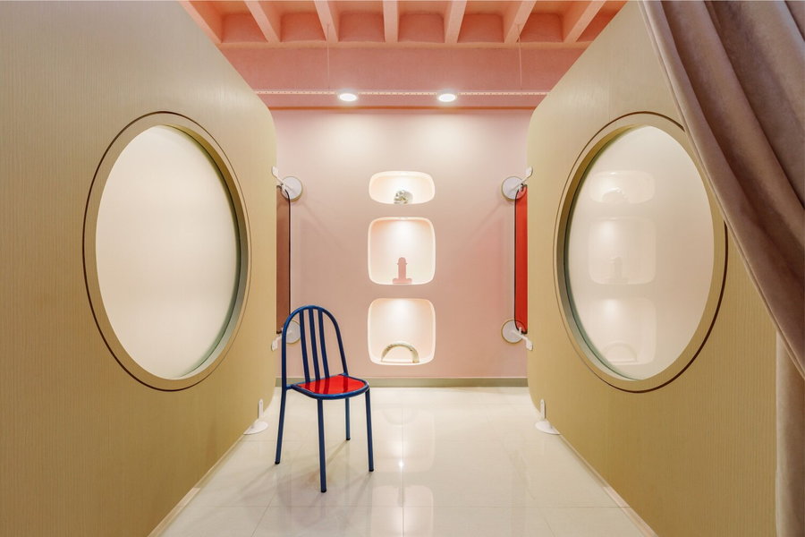 Large circular windows and cold white plastics bring the feel of Stanley Kubrick's 
