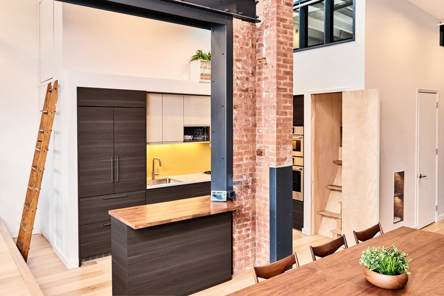 Small stylish kitchen space inside the OSSO-renovated Boerum Hill Loft in Brooklyn. 