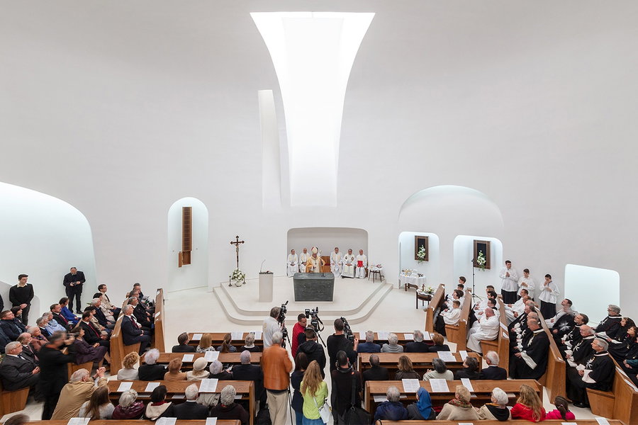 An actual mass being held inside the minimalistic Saint Pope John Paul II Church.