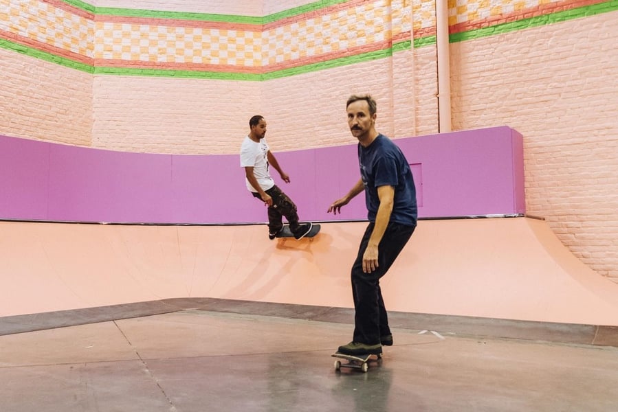 Skaters enjoy the brightly-colored ramps and half-pipes inside artist Yinka Ilori's Colorama Skatepark.
