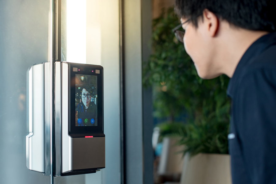 Employee uses facial recognition technology to gain access to his office building. 