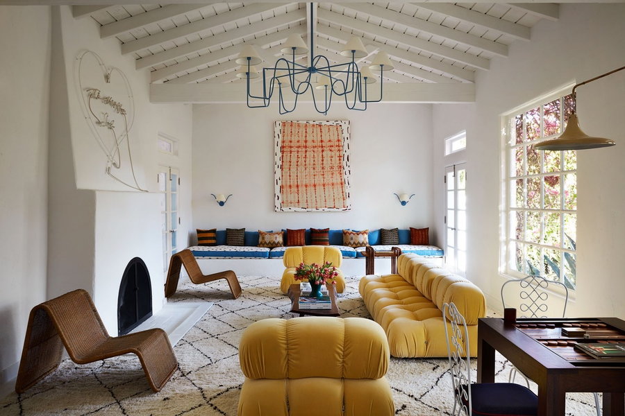 Eclectic yet understand living space in film producer Grace Morton's revamped Spanish style LA home. 