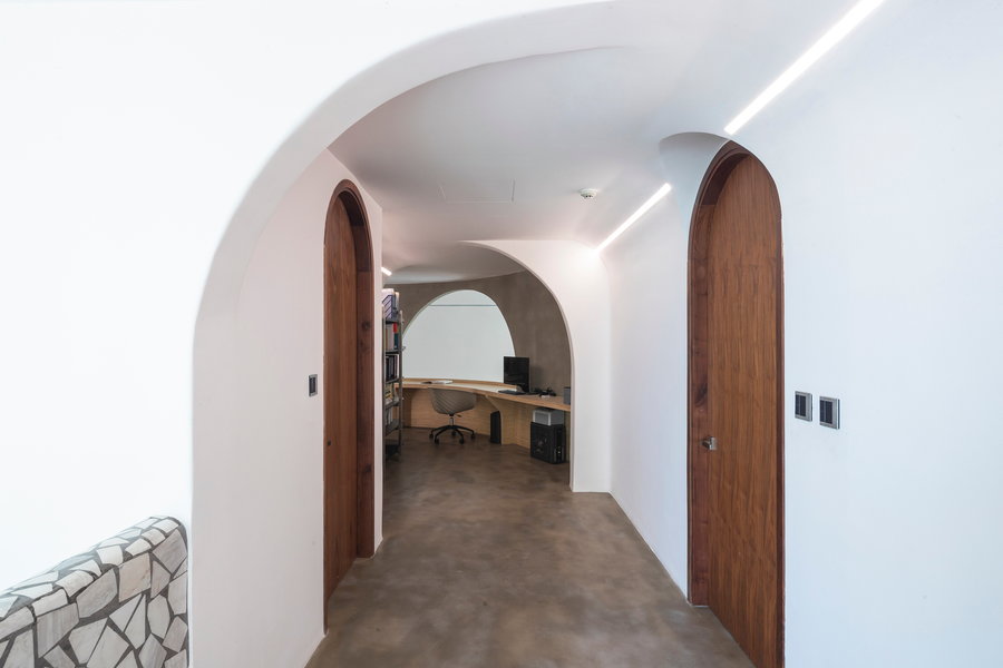 A sleek, simple hallway inside the Whale Design Lab-renovated Mai Apartment.