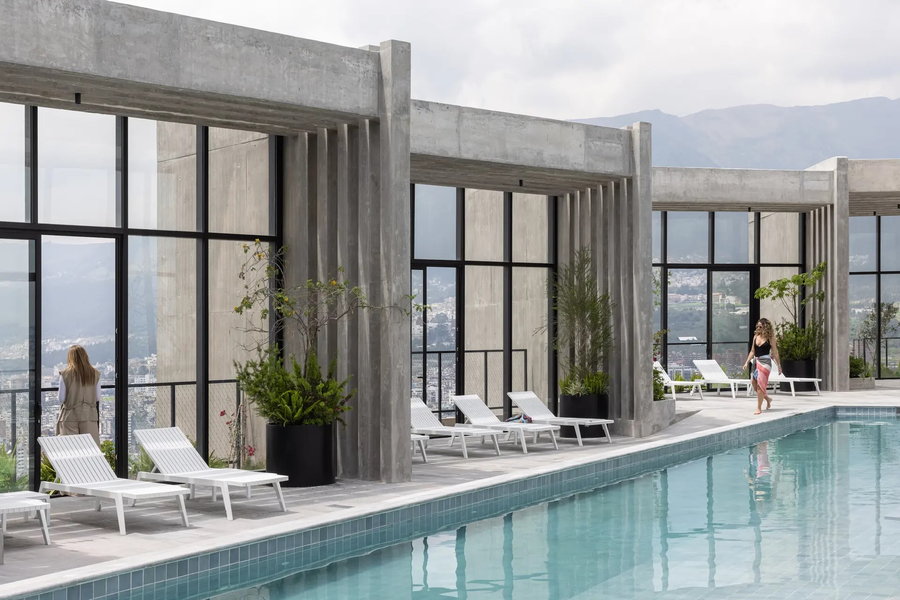Residents enjoy view of the city from the IQON building's luxurious rooftop pool.