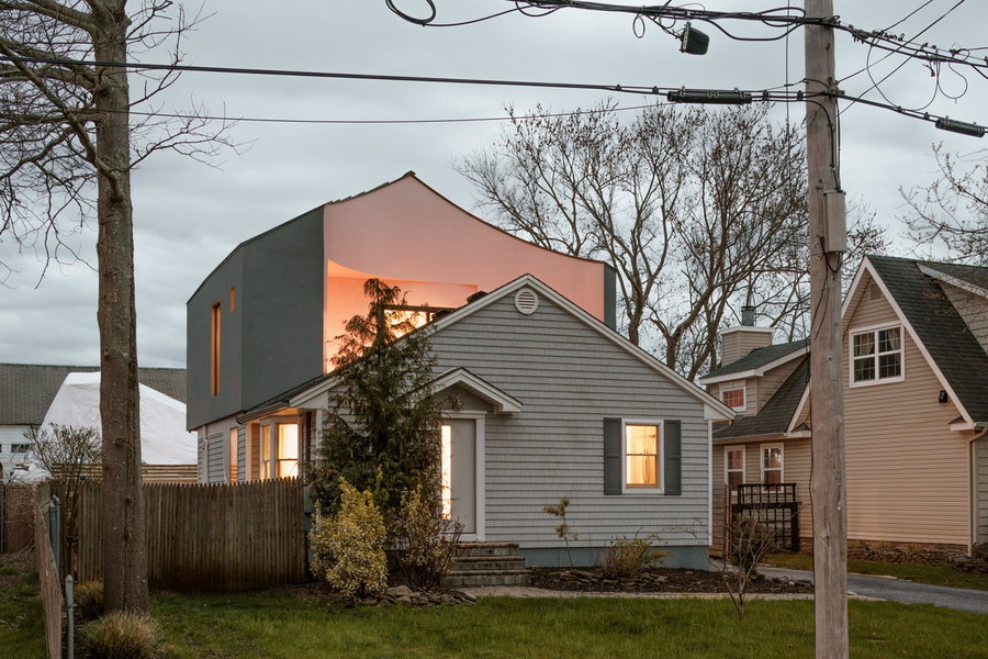 When the lights inside the House on House are turned on, they shine against the pink exterior for a sunset effect.