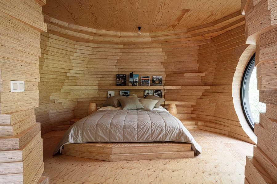 Depending on where you are inside it, the interiors of this guest house can feel incredibly open or incredibly cave-like.