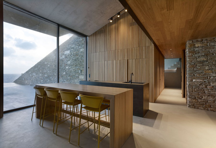 Sleek minimalist dining area inside the Mold Architects-designed 
