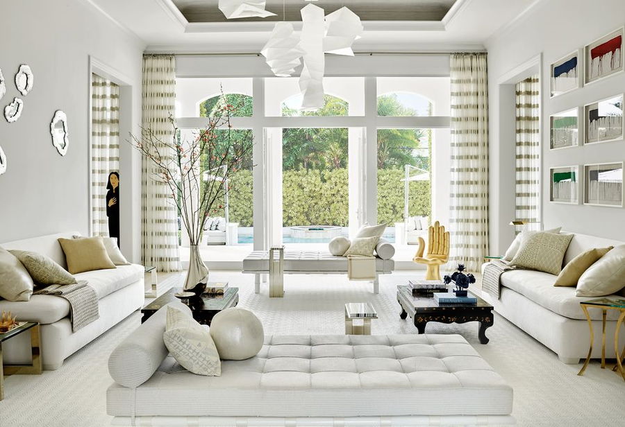 Matching antique coffee tables inside a Palm Beach home, designed by designers James Atman and John Meeks.