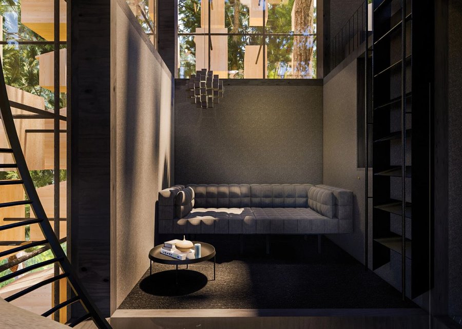 Modern black living space inside the BIG-designed Biosphere treehouse.