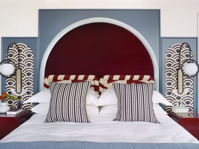 Elegant principal bedroom adorned with geometric patterns inside Owl Interior Design's David Bowie-inspired London apartment. 