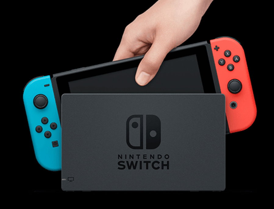 Hand pulls a Nintendo Switch from TV Stand