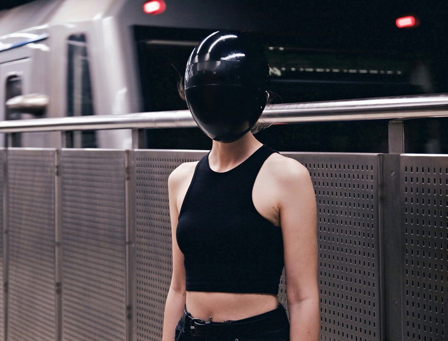 Woman wears her Daft Punk-style Blanc Full-Face Modular Mask