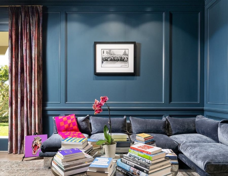 Cozy home library space in Katy Perry's on-sale Beverly Hills mansion is coated in a deep, soothing blue.