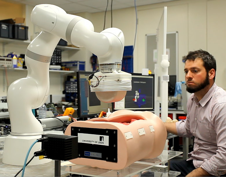 Researcher uses the magnetic tentacle robot on a 3D model of a lung.