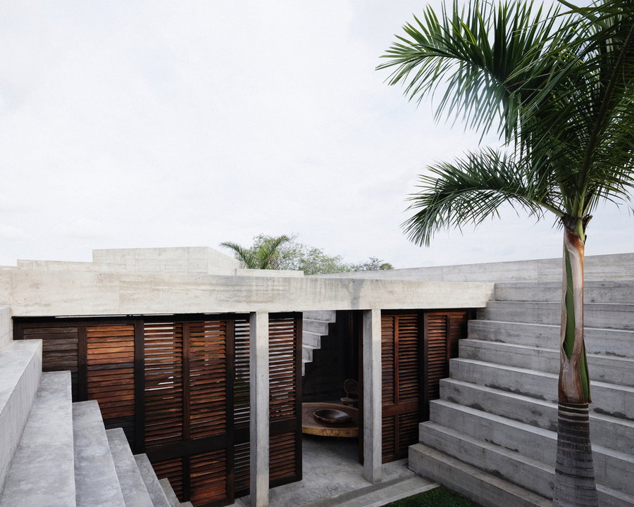 Timber shutters and wide open doorways keep the otherwise-cold feeling Zicatela House connected to nature at all times. 