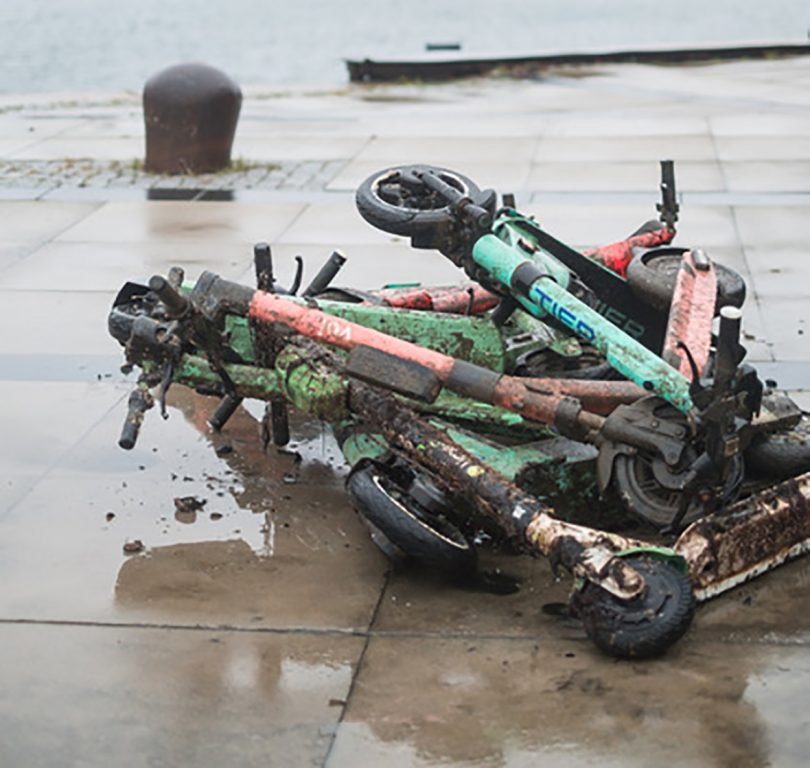 Pile of e-scooters covered in mud after being pulled from the bottom of Sweden's Malmö canals. 
