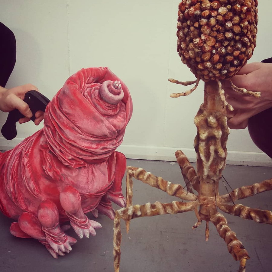 Puppet versions of a bacteriophage and water bear by artist Judith Hope.