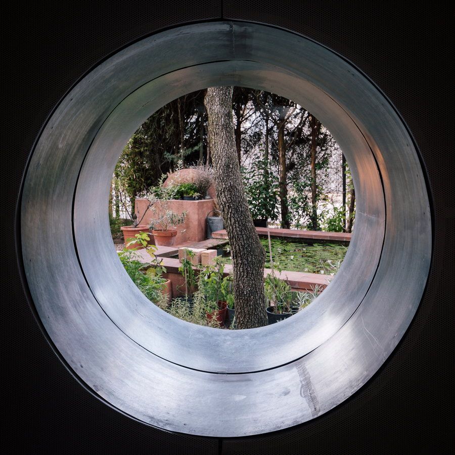 A single large porthole inside the Burrow allows occupants to peer out at the world outside.