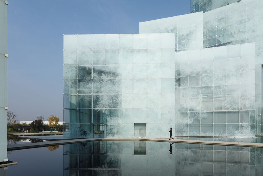 Parts of the opaque Xinxiang Tourism Center become translucent when plunged in shadow.