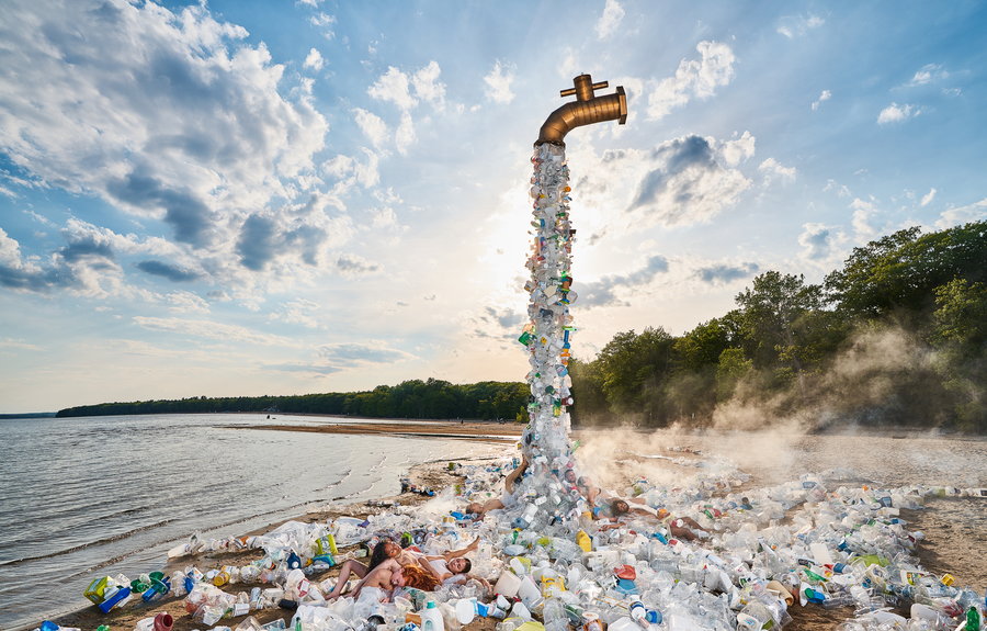 Models pose in the waste created by Benjamin Van Wong's giant 
