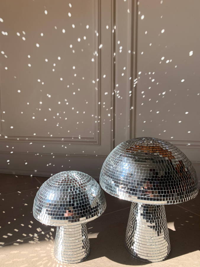 Disco ball-like mushroom sculptures light up a small living space.