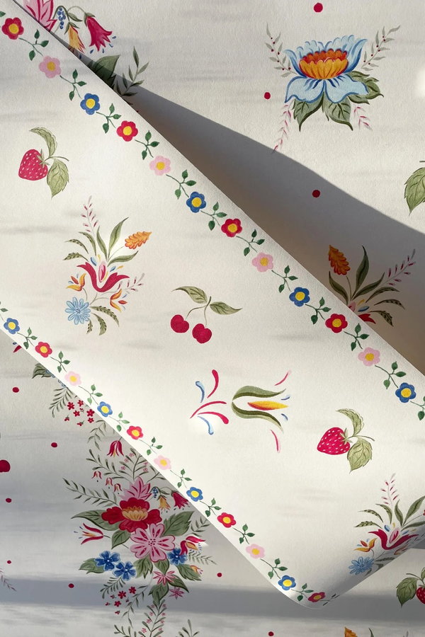 Close-up view of a bright fruit-themed wallpaper border.