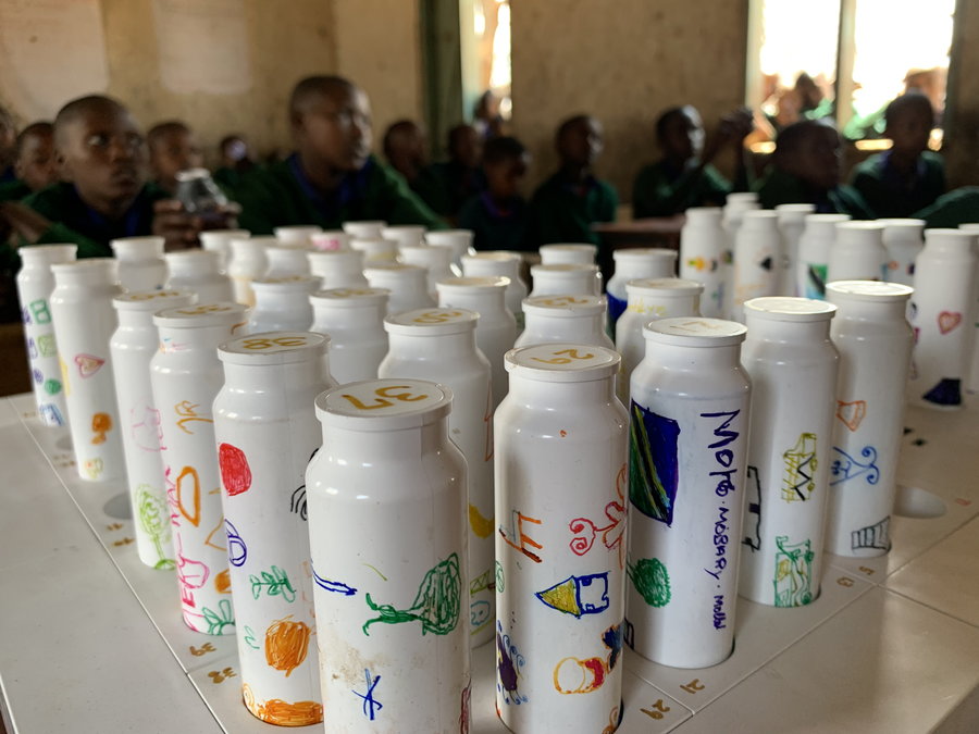 Each student's solar battery is numbered at this Tanzanian grade school.