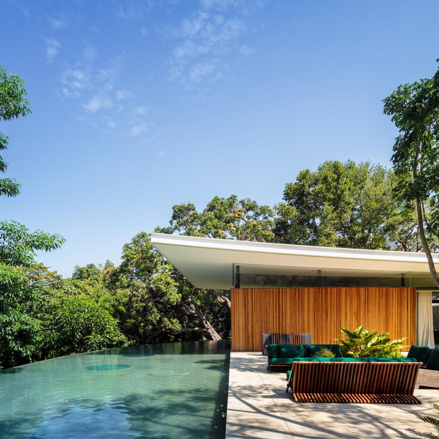 A lavish swimming pool sits to one side of the main Asa House volume.