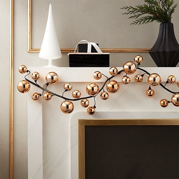 CB2's Rose Gold Ball Garland makes for a lovely metallic accent in any modern holiday decor.