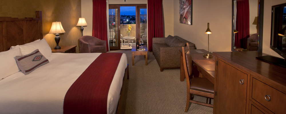 Spacious guest rooms feature New Mexico Revival decor, handcrafted native inspired furniture and local art pieces, and some offer balconies with views of Santa Fe city and the Sangre de Cristo mountains.