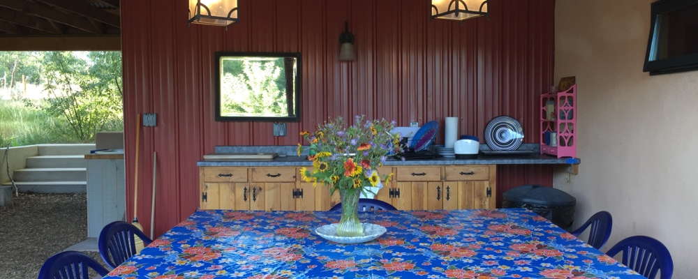 Guests can grill and eat together in the breezeway. Maps and guides to hikes on the land are located here, too.