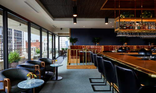 Ellington's Mid Way Bar & Grill with wraparound terrace, located on the 4th Floor of the Fairlane Hotel.