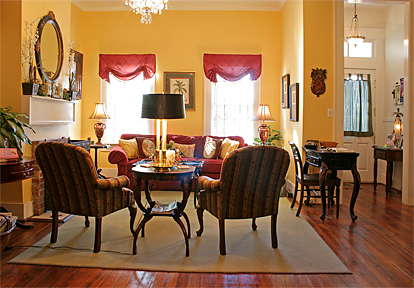 Savannah's southern welcome and friendly reputation plays out in the inn's living room with cozy fireplace.
