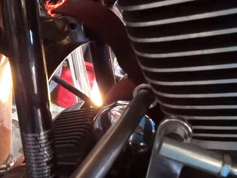 Use a strap wrench to loosen the old filter and remove by hand