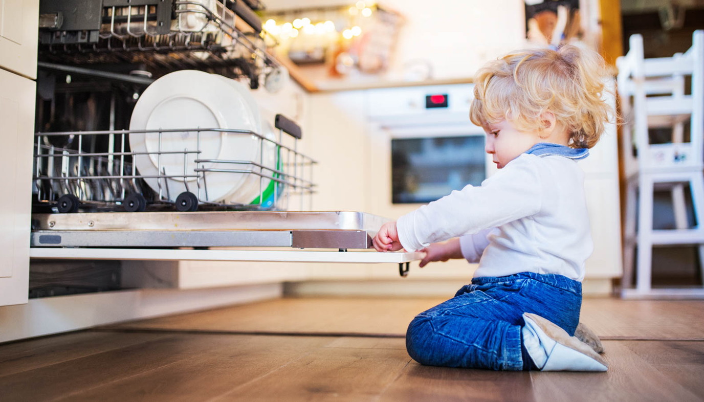 toddler climbing on dishwasher